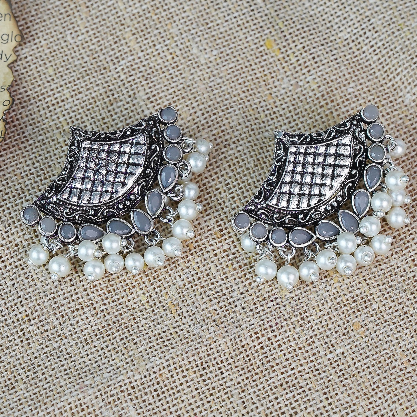 Gray Stone Studded Lotus Petal Shaped Oxidised Earrings With Hanging Line Of Pearl
