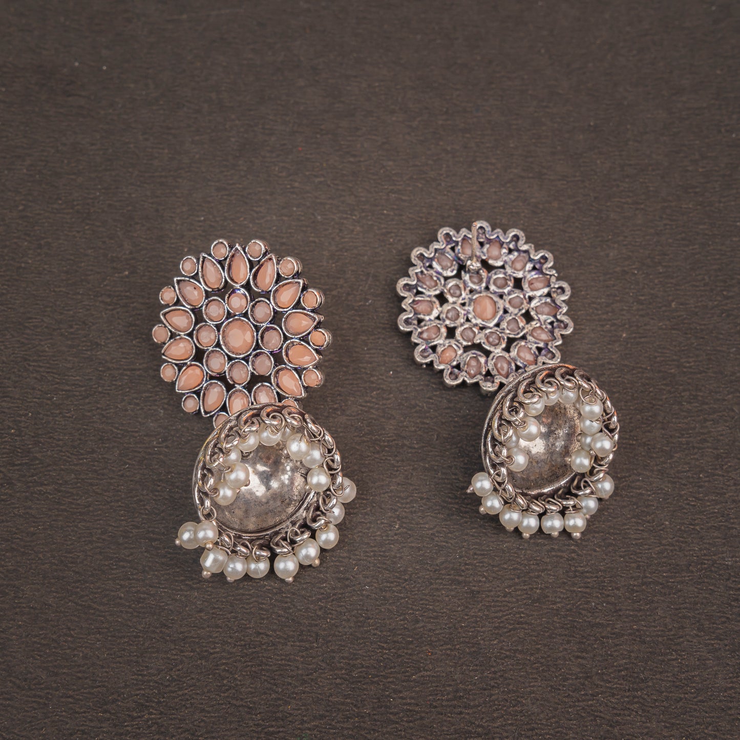 Floral carves stone studded jhumki earrings (Light Orange)