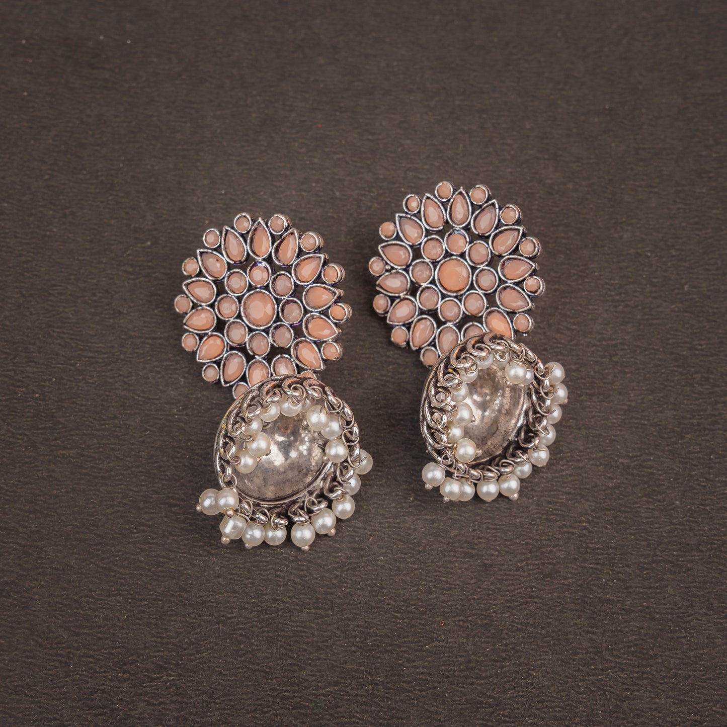 Floral carves stone studded jhumki earrings (Light Orange)