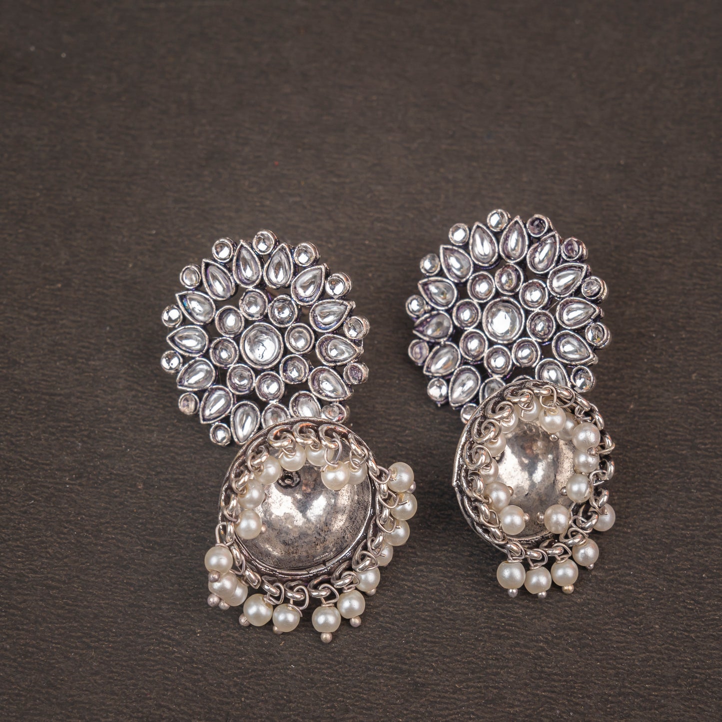 Floral carves stone studded jhumki earrings (White)