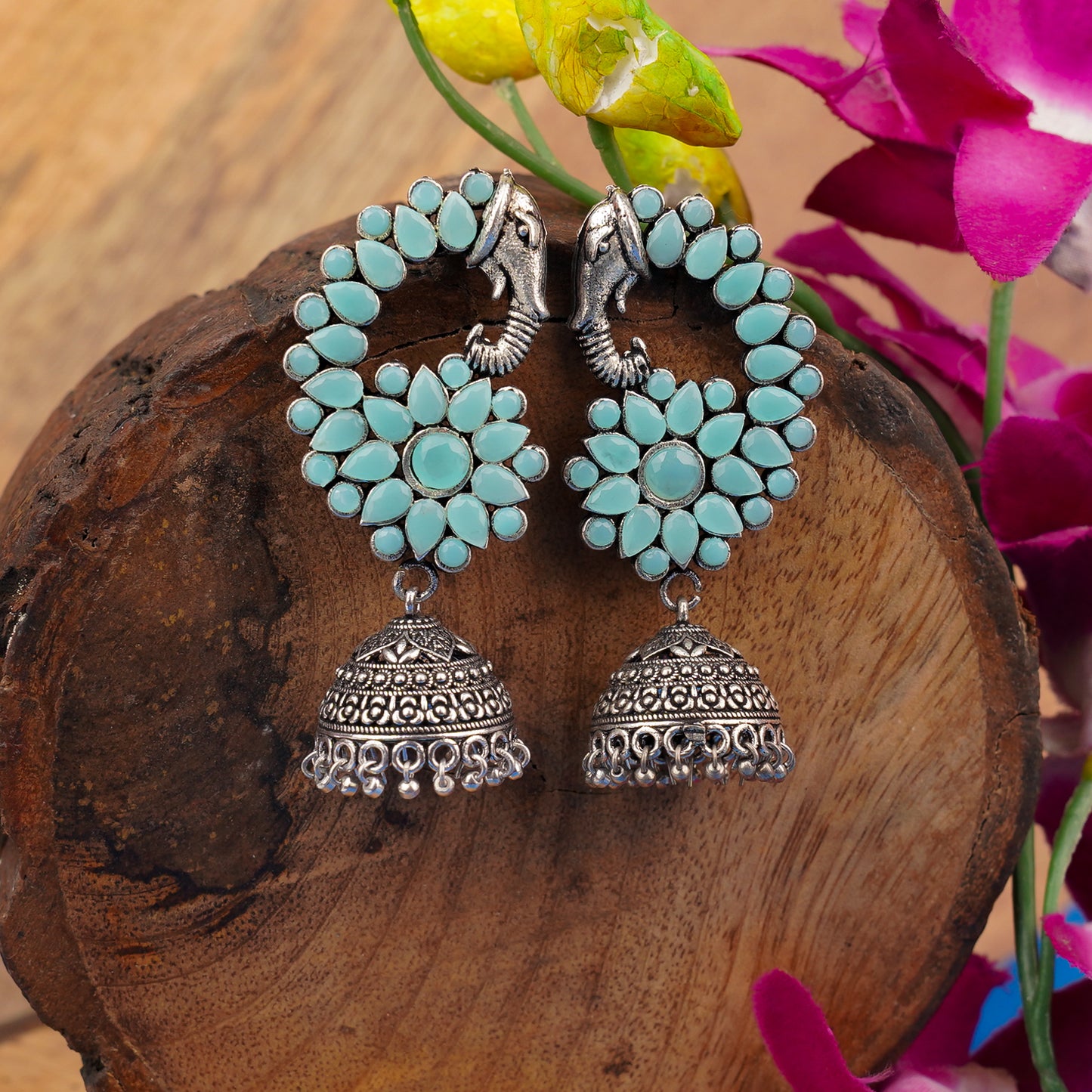 Tusks and twinkle stone studded jhumka earrings (Mint)