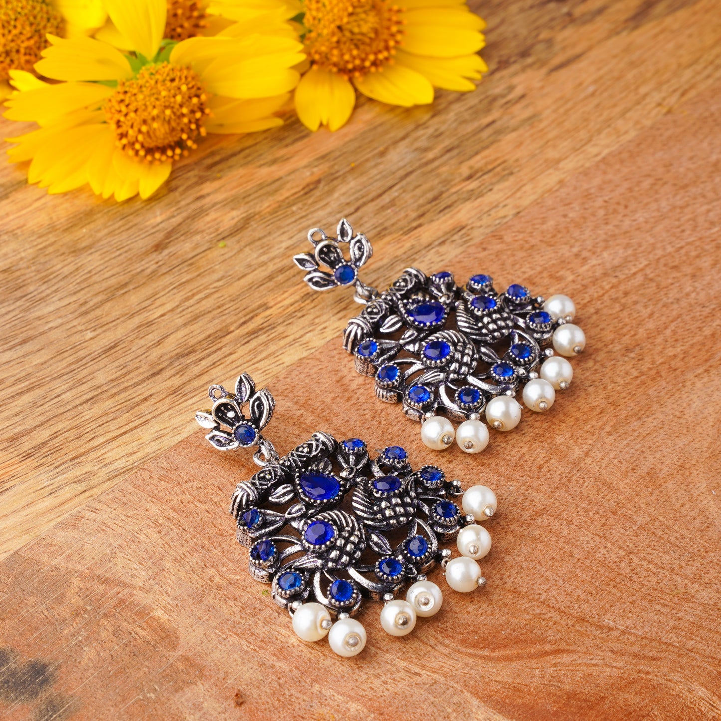 Peacock glow stone studded dangler earrings (Blue)