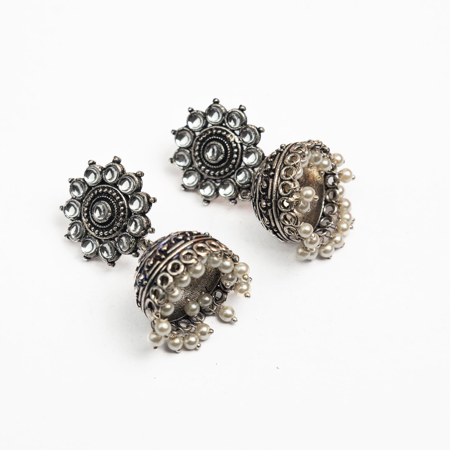 White Stone Studded German Silver Jhumki Earrings With Hanging Pearls