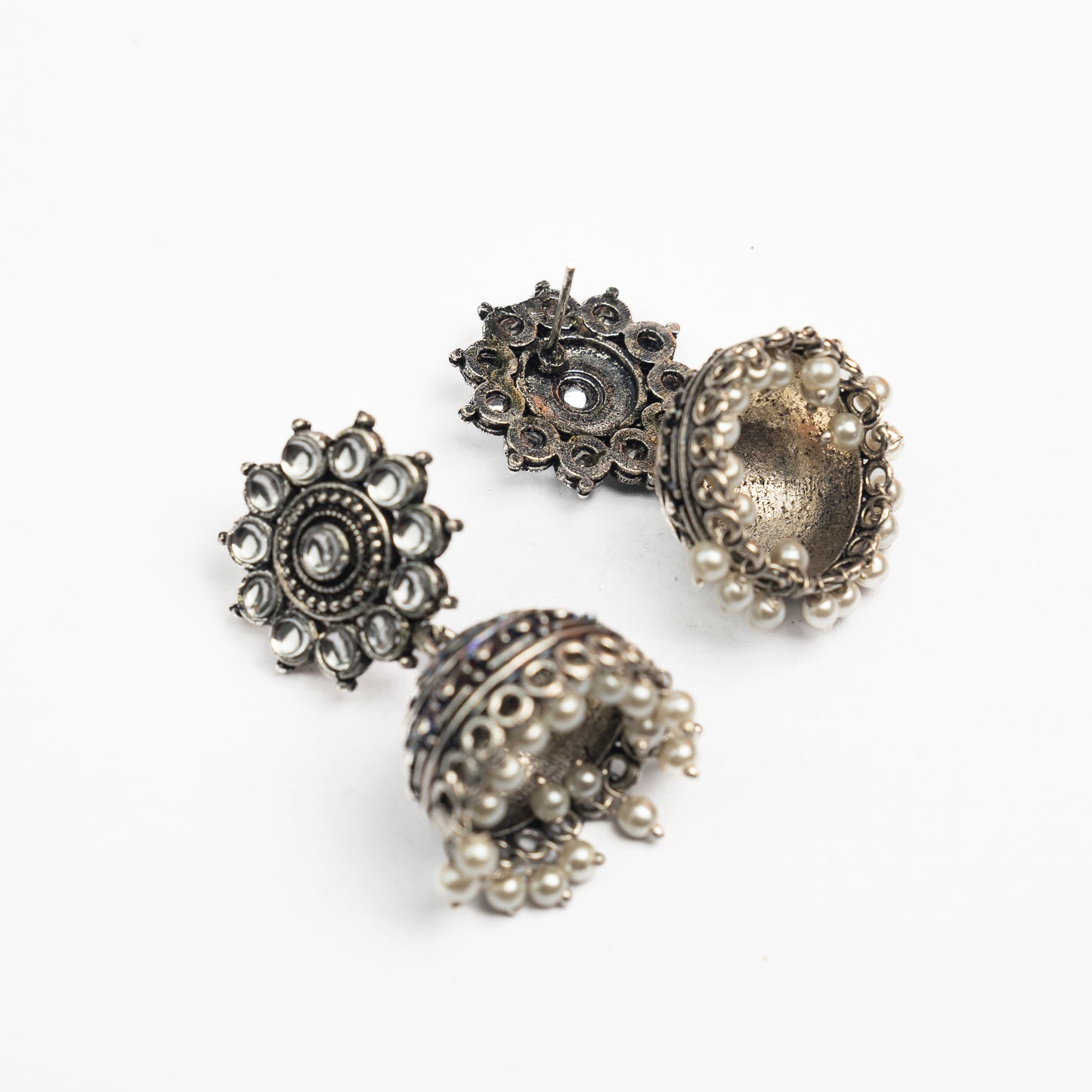 White Stone Studded German Silver Jhumki Earrings With Hanging Pearls
