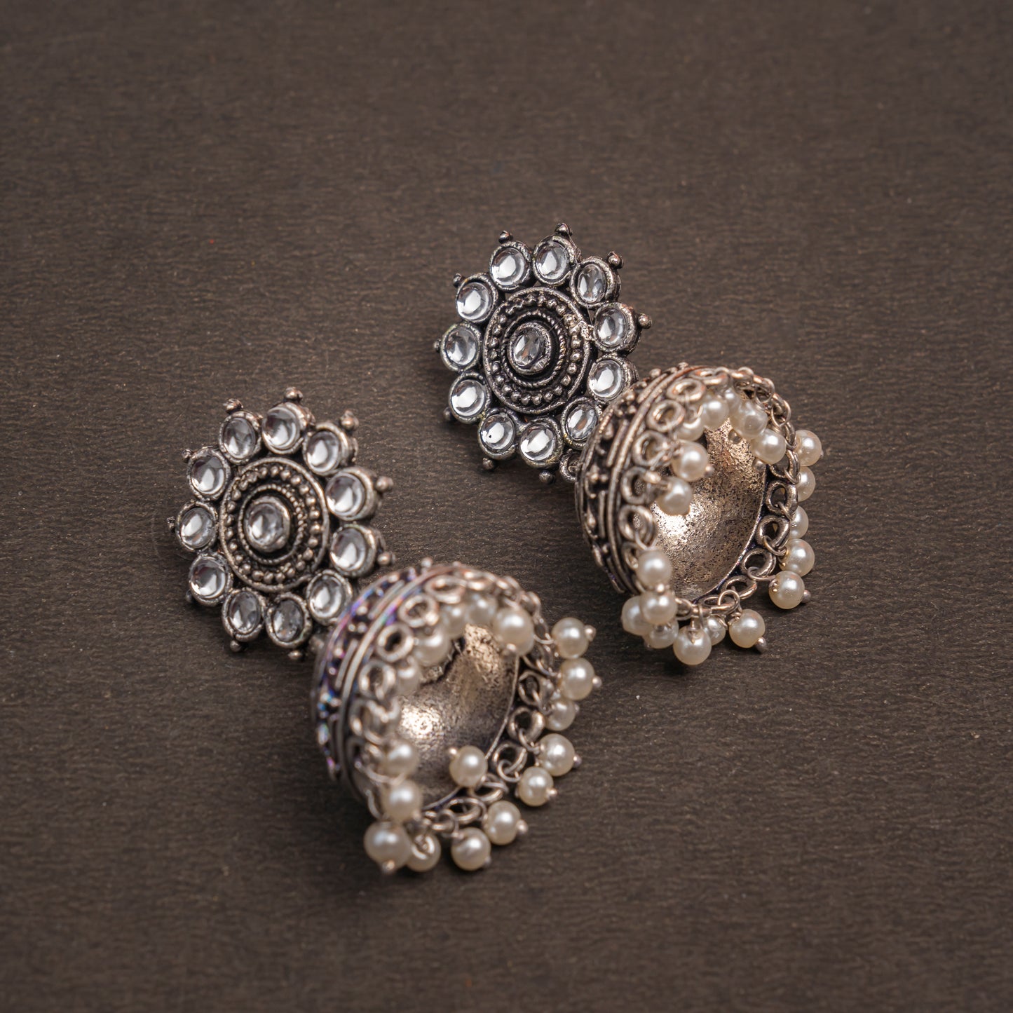 White Stone Studded German Silver Jhumki Earrings With Hanging Pearls