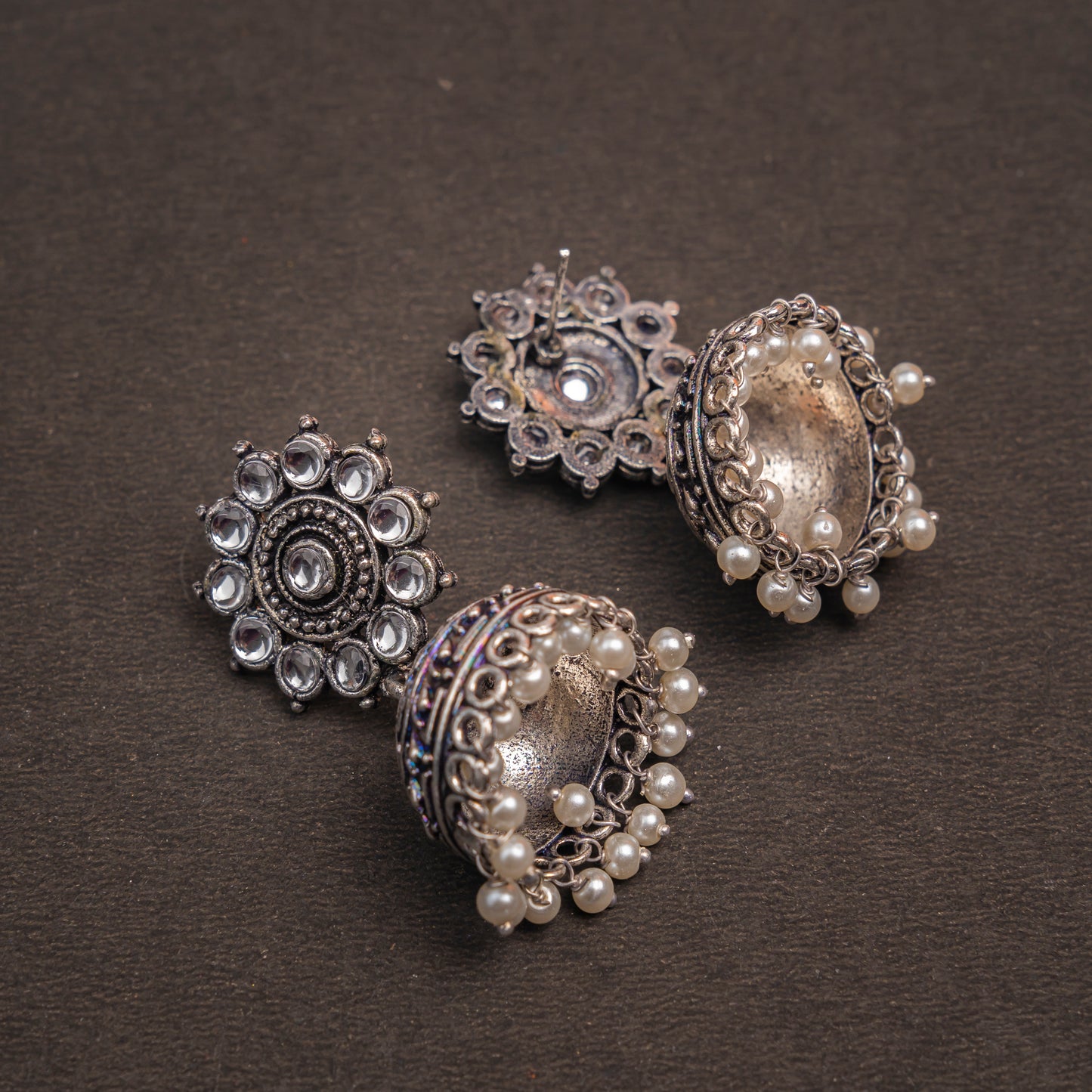 White Stone Studded German Silver Jhumki Earrings With Hanging Pearls
