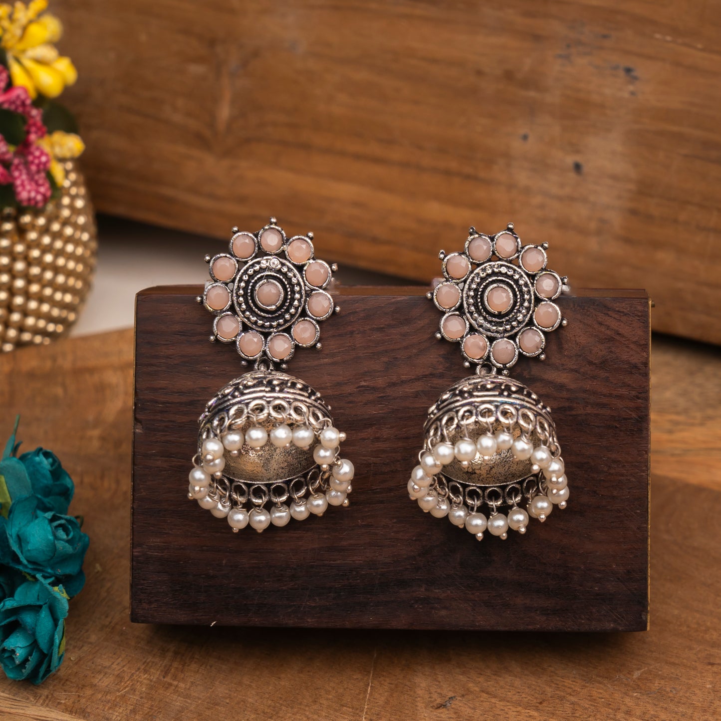 Light Orangish Stone Studded German Silver Jhumki Earrings With Hanging Pearls