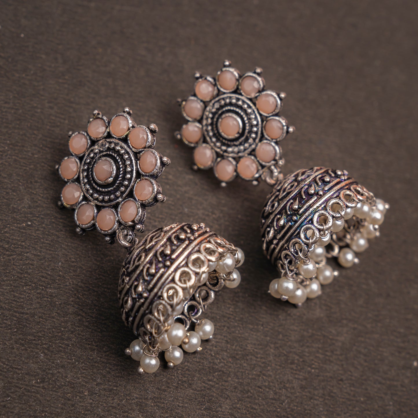 Light Orangish Stone Studded German Silver Jhumki Earrings With Hanging Pearls