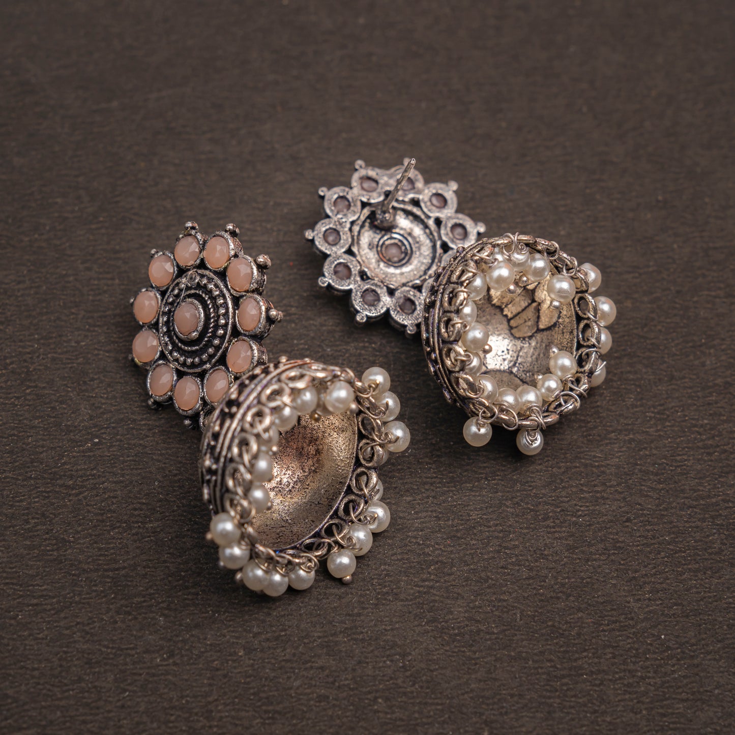 Light Orangish Stone Studded German Silver Jhumki Earrings With Hanging Pearls