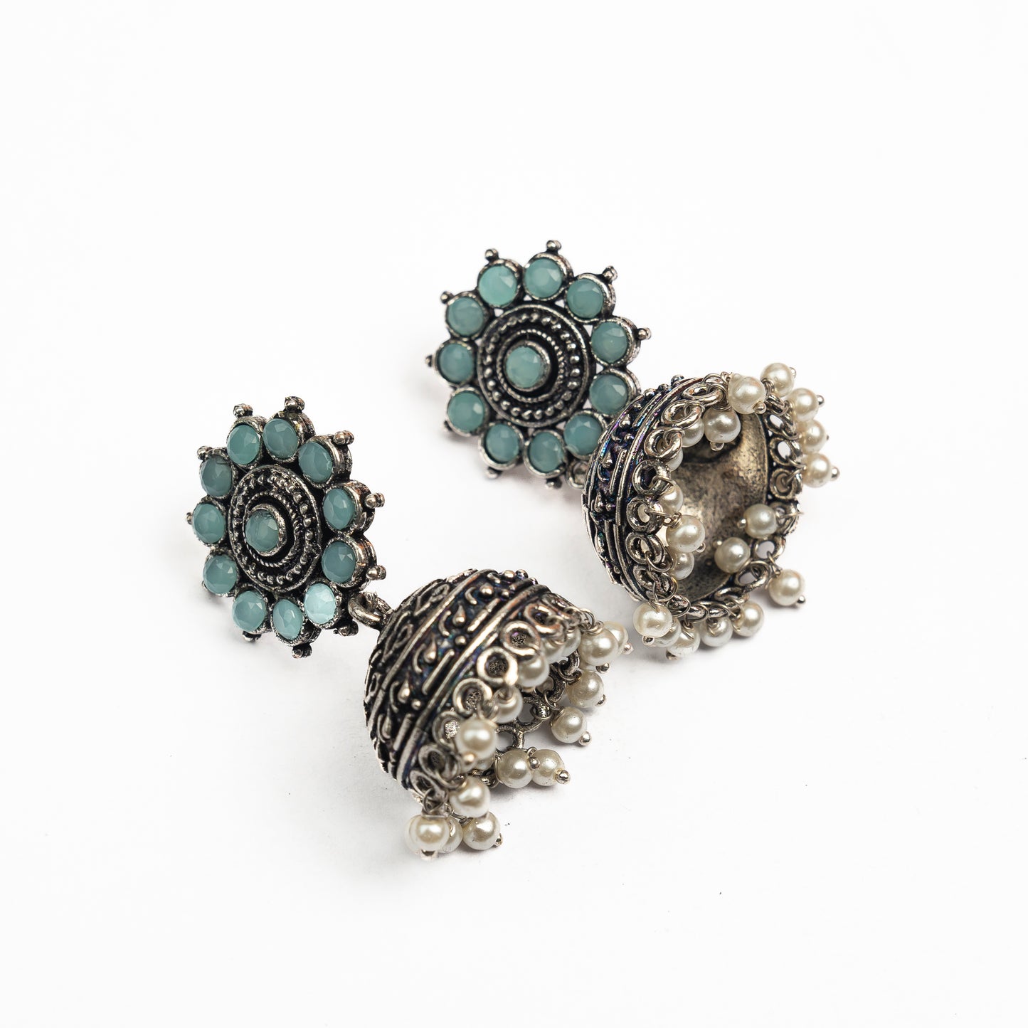 Mint Stone Studded German Silver Jhumki Earrings With Hanging Pearls