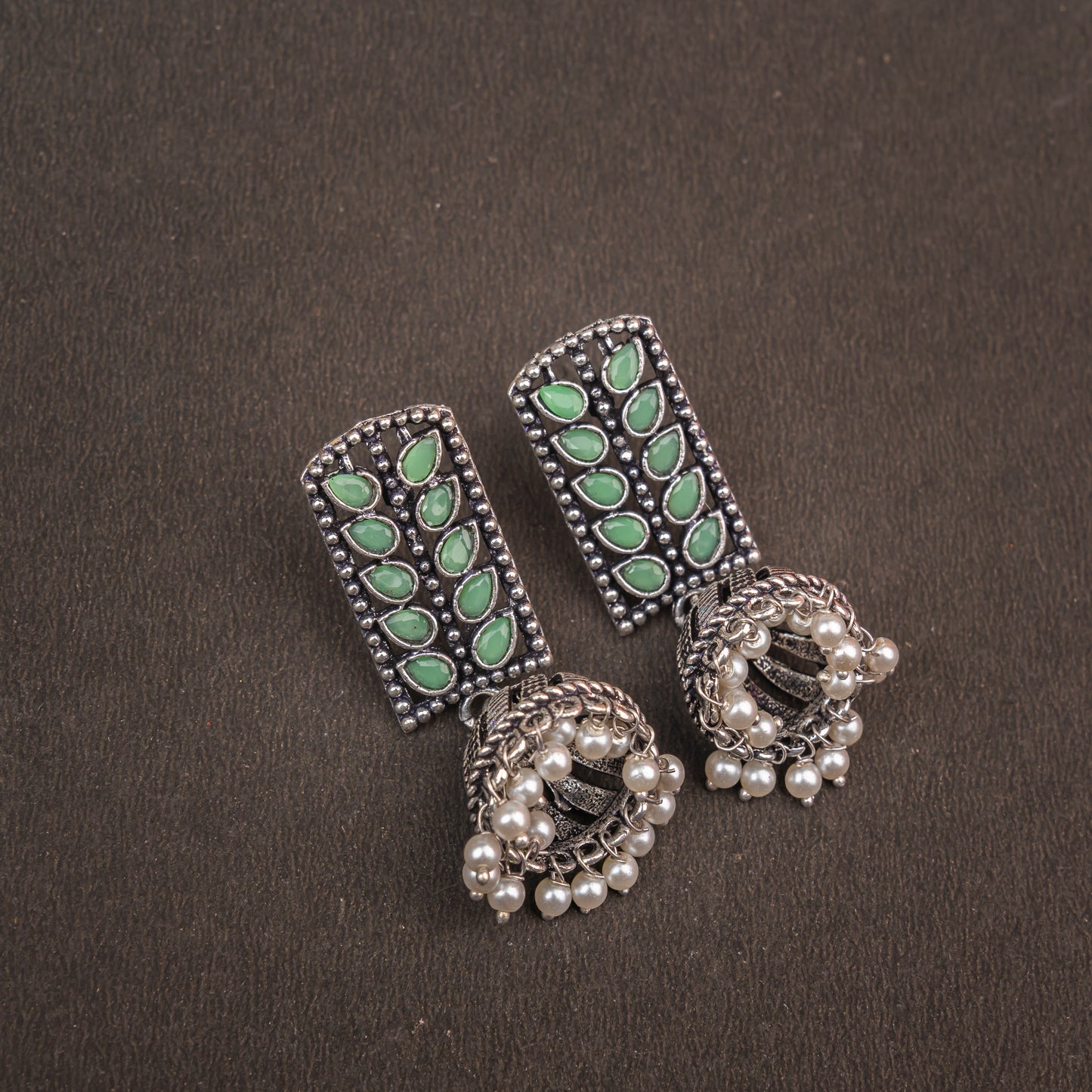 Regal leaffall stone studded jhumki earrings (Pista)