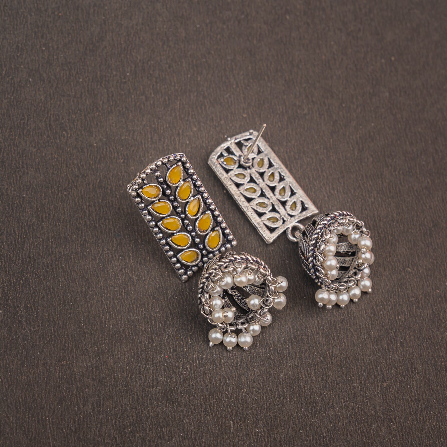 Regal leaffall stone studded jhumki earrings (Yellow)