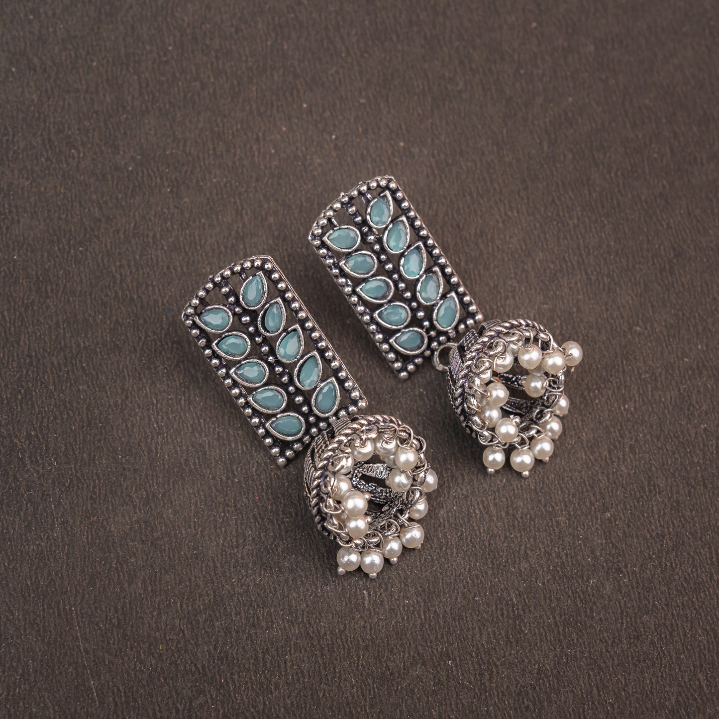Mint Stone Studded German Silver Statement Earrings With Brass Jhumki