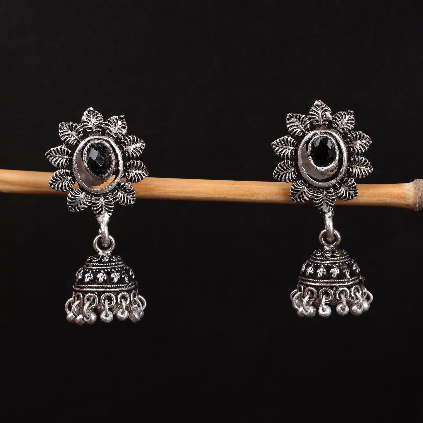 Stone studded floral jhumki earrings (Black)
