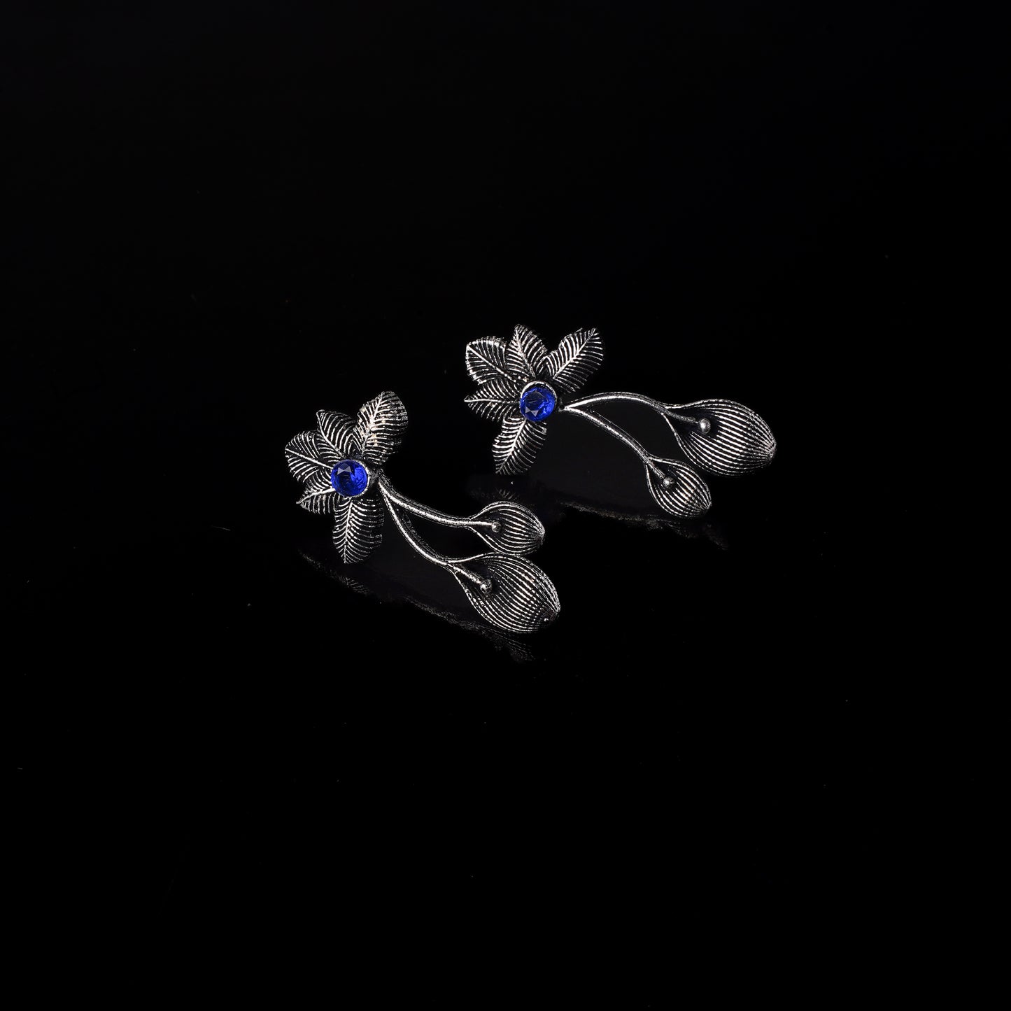 Blue Stone Studded Flower Shaped Intricate Oxidised Earrings