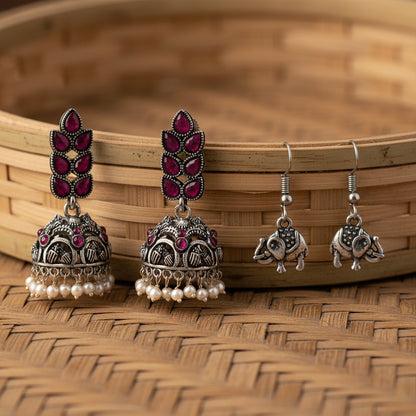 Leaf Cascade jhumki earrings (Red) Trunk Tales dangler earrings (Silver) Combo set