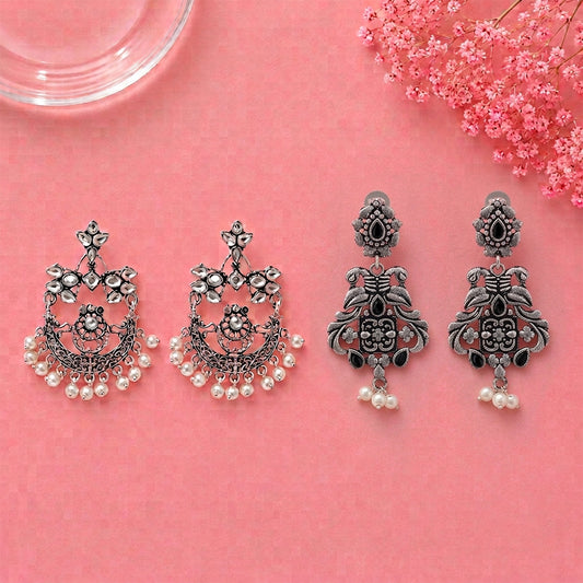 Carved Charm Dangler earrings (White) Feathered Grace dangler earrings (Black) Combo set