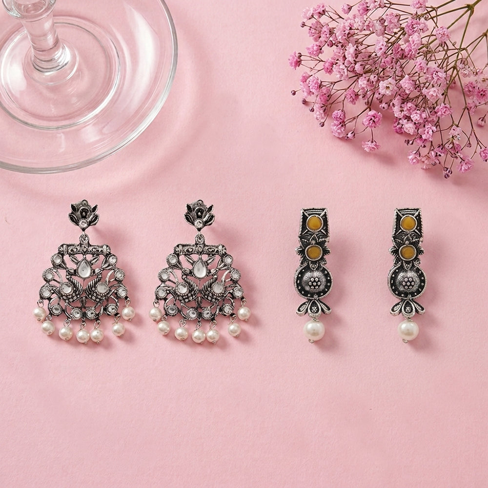 Peacock glow stone studded dangler earrings (White) Wonderful wildflower oxidised stud earrings (Yellow) Combo set
