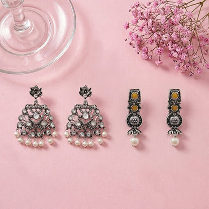 Peacock glow stone studded dangler earrings (White) Wonderful wildflower oxidised stud earrings (Yellow) Combo set