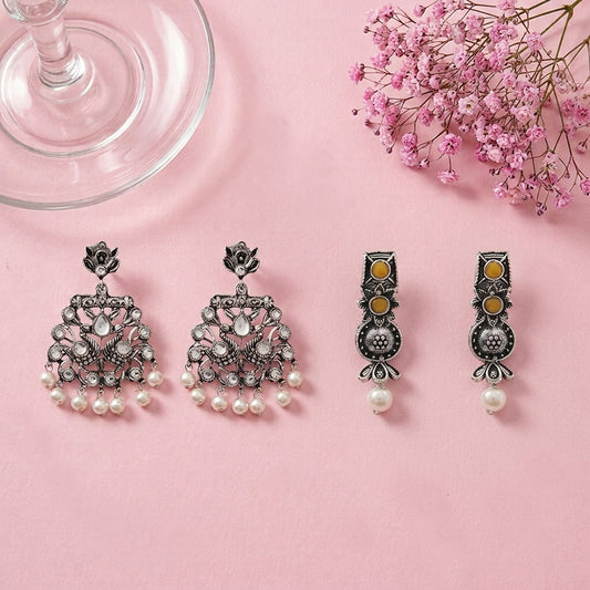 Peacock glow stone studded dangler earrings (White) Wonderful wildflower oxidised stud earrings (Yellow) Combo set