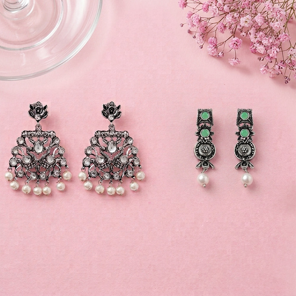 Peacock glow stone studded dangler & Wonderful wildflower oxidised stud set
