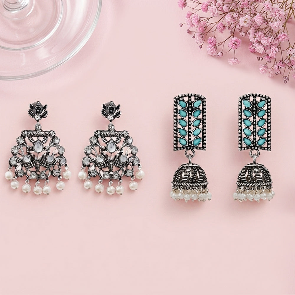 Peacock glow stone studded dangler & Regal leaffall stone studded jhumki set