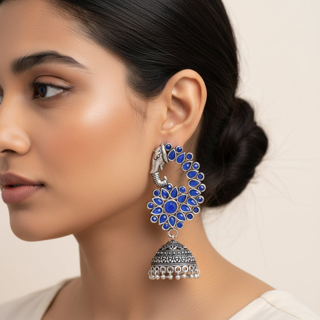 Tusks and twinkle stone studded jhumka earrings (Blue)