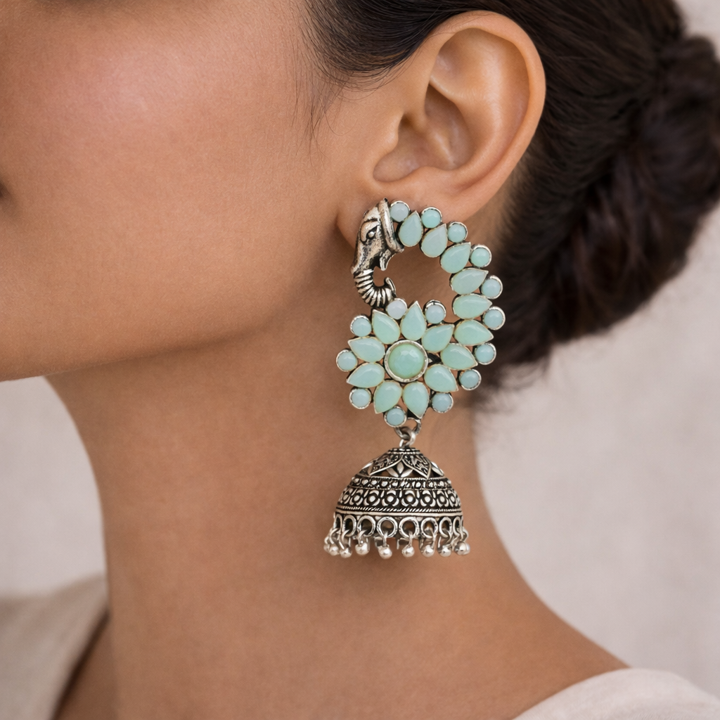 Tusks and twinkle stone studded jhumka earrings (Mint)