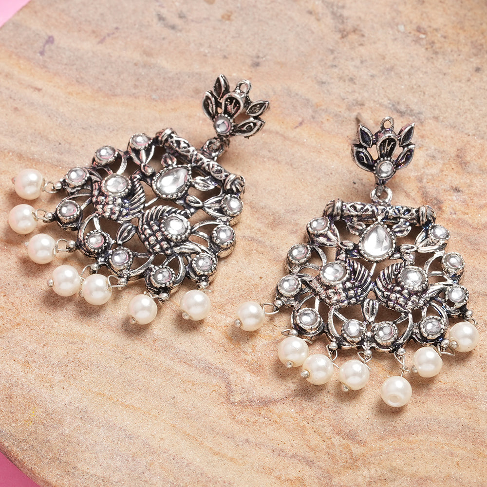 Peacock glow stone studded dangler earrings (White)