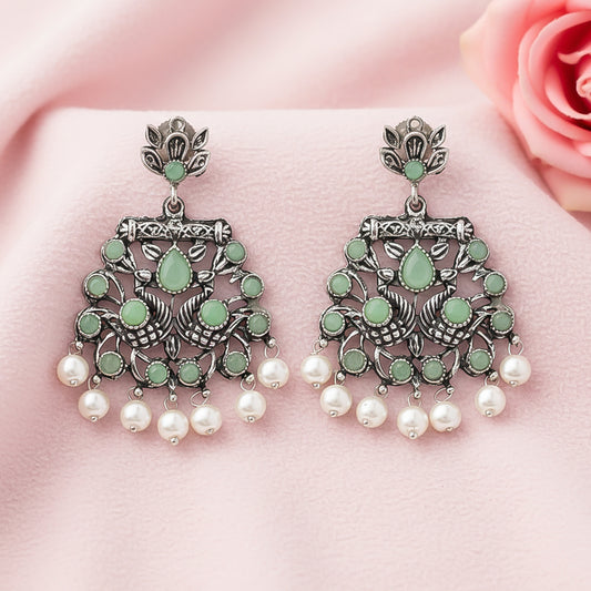 Peacock glow stone studded dangler earrings (Pista)