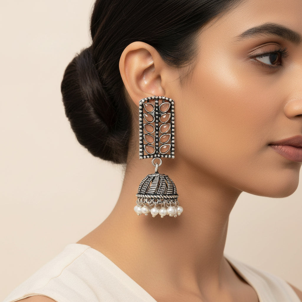 Regal leaffall stone studded jhumki earrings (Light Orange)