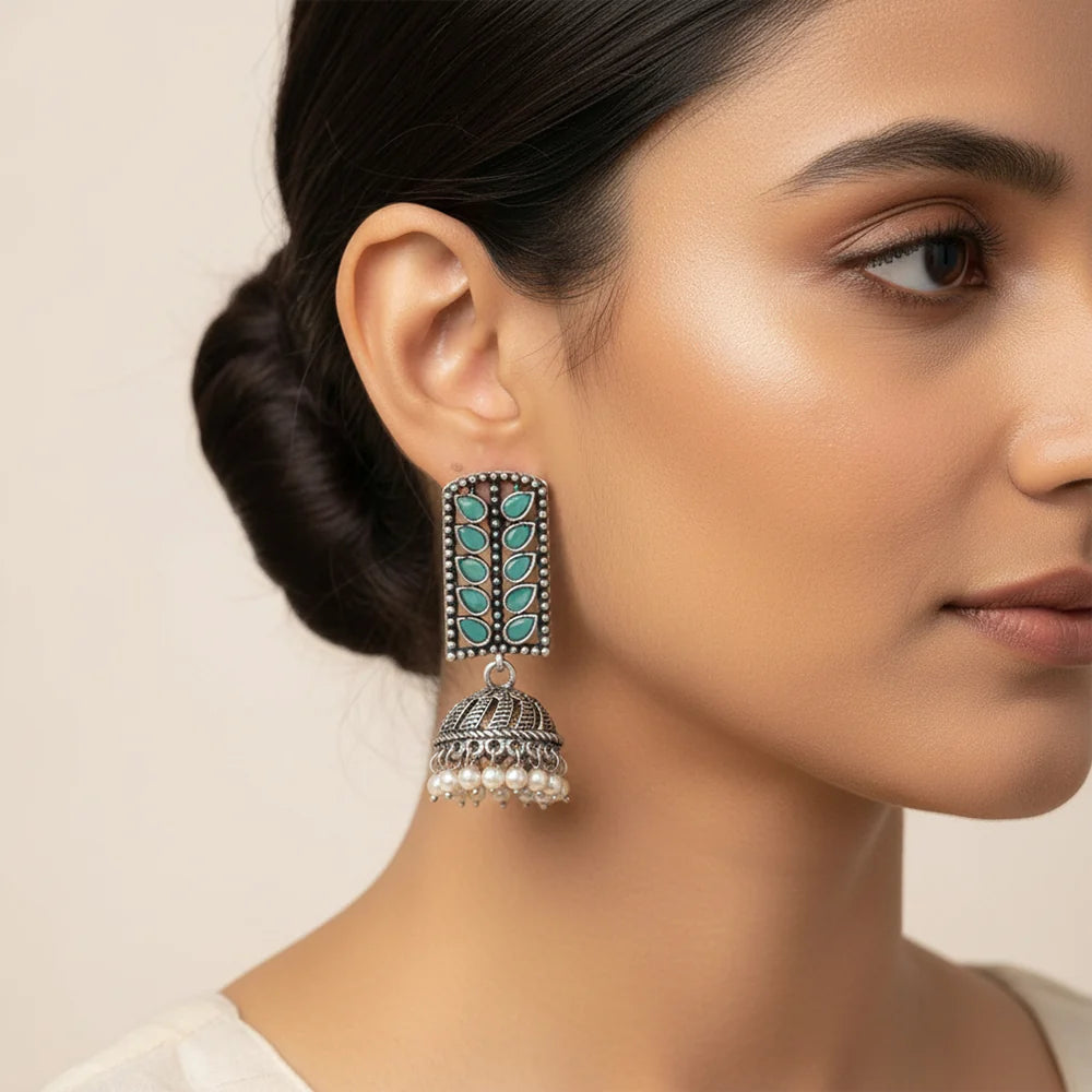Peacock glow stone studded dangler & Regal leaffall stone studded jhumki set