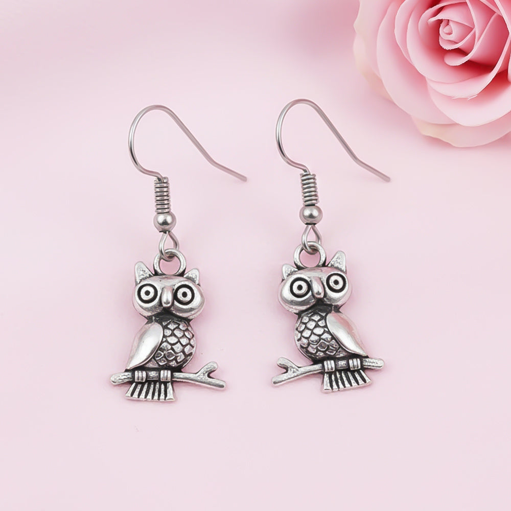 Wise Wink dangler earrings (Silver)
