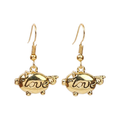 Treasure oink dangler earrings