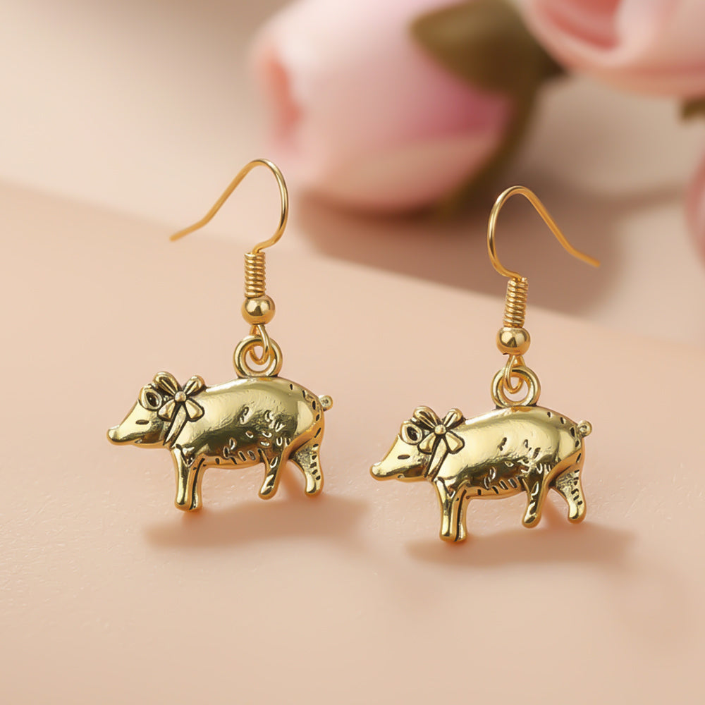piggy dangler earrings
