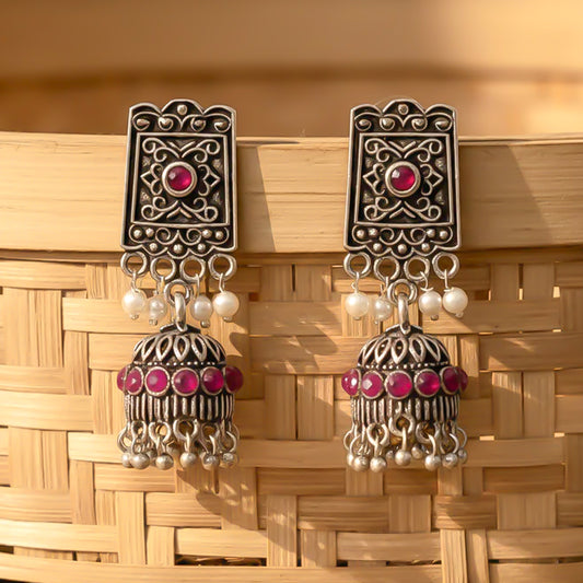 oxidized  jhumka earrings with pearl and Red stone detailin.
