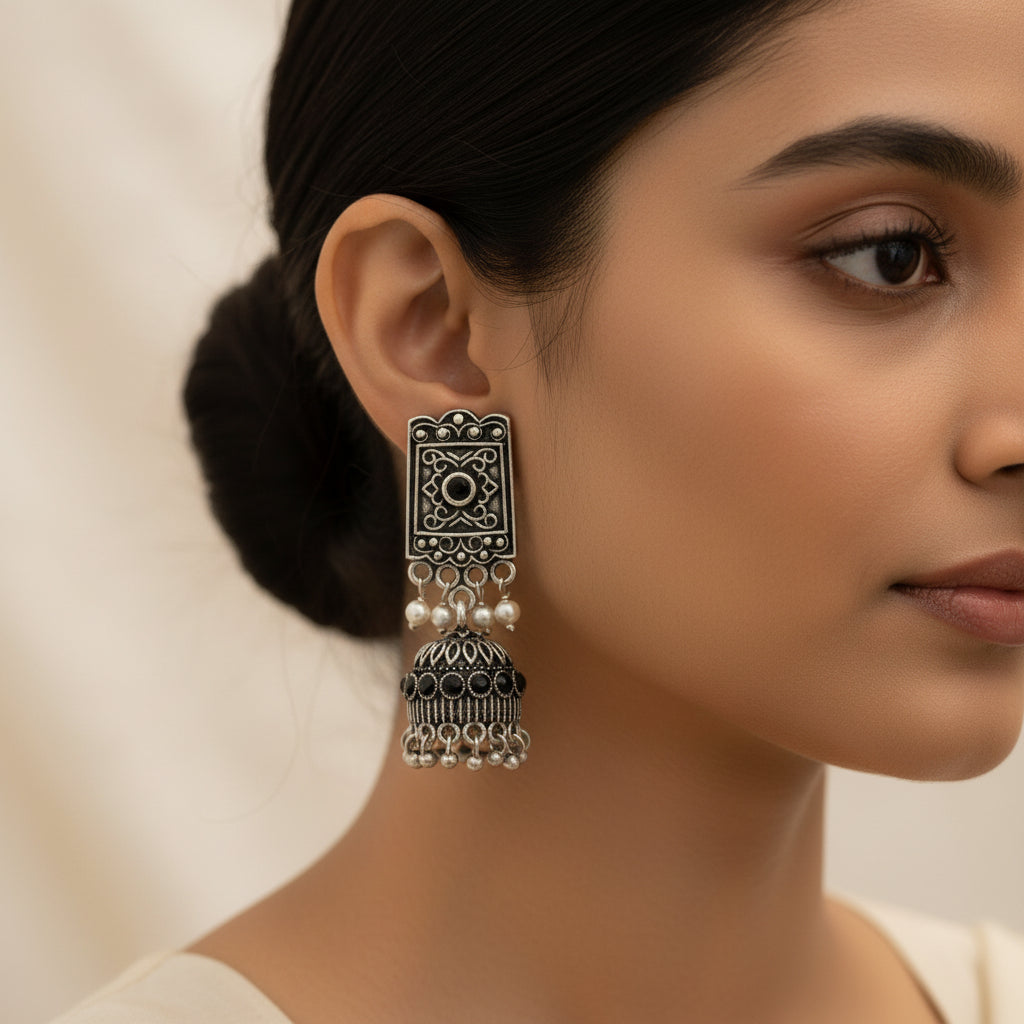oxidized  jhumka earrings with pearl and Black stone detailing.