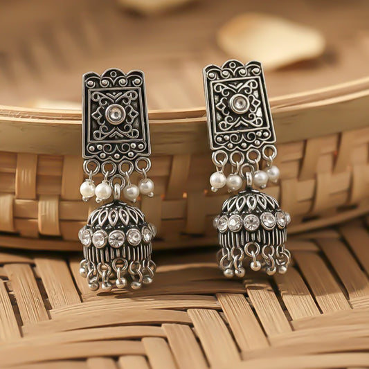 oxidized  jhumka earrings with pearl and white stone detailing.