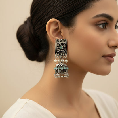 oxidized  jhumka earrings with pearl and mint stone detailing.