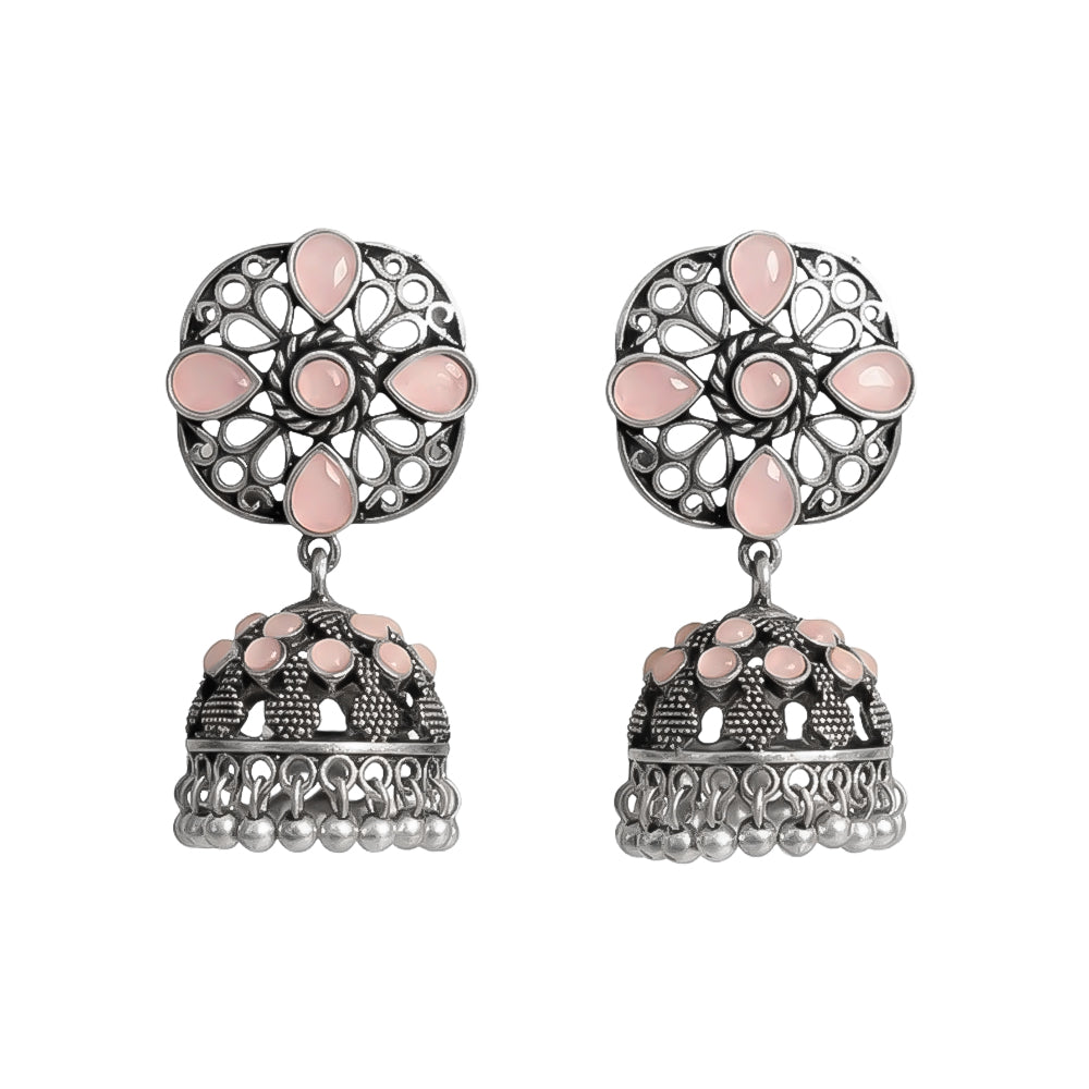oxidized floral jhumka earrings with baby pink stone detailing.