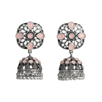 oxidized floral jhumka earrings with baby pink stone detailing.