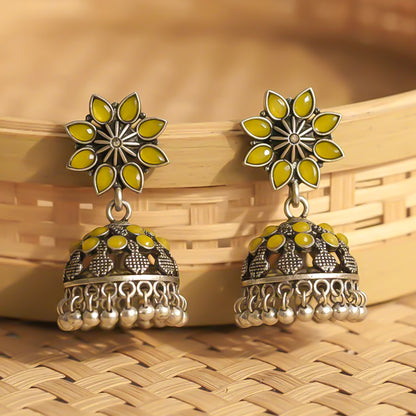 flower-shaped top with petal-like yellow stones
