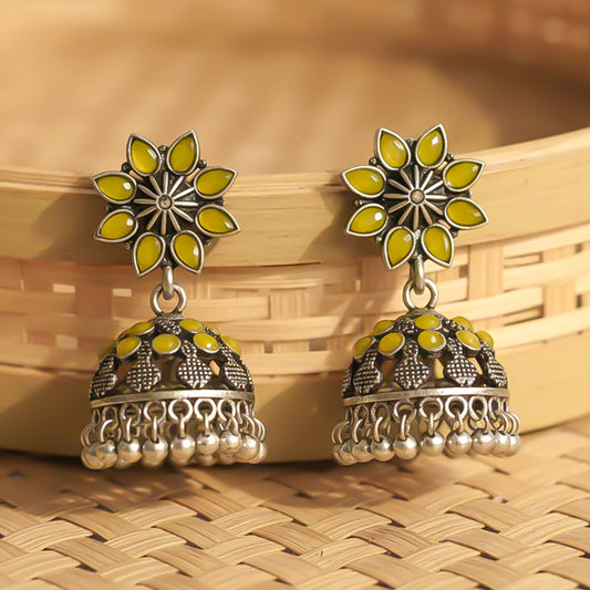 flower-shaped top with petal-like yellow stones