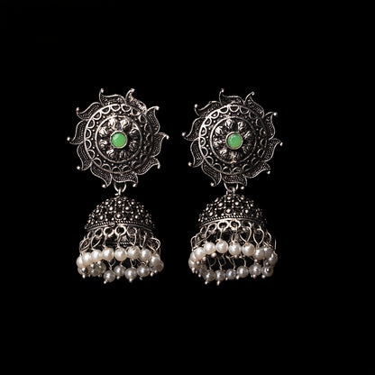 Pista Stone Studded German Silver Statement Earrings With Brass Jhumki