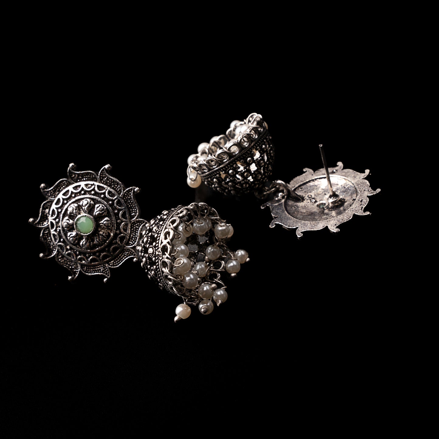 Pista Stone Studded German Silver Statement Earrings With Brass Jhumki
