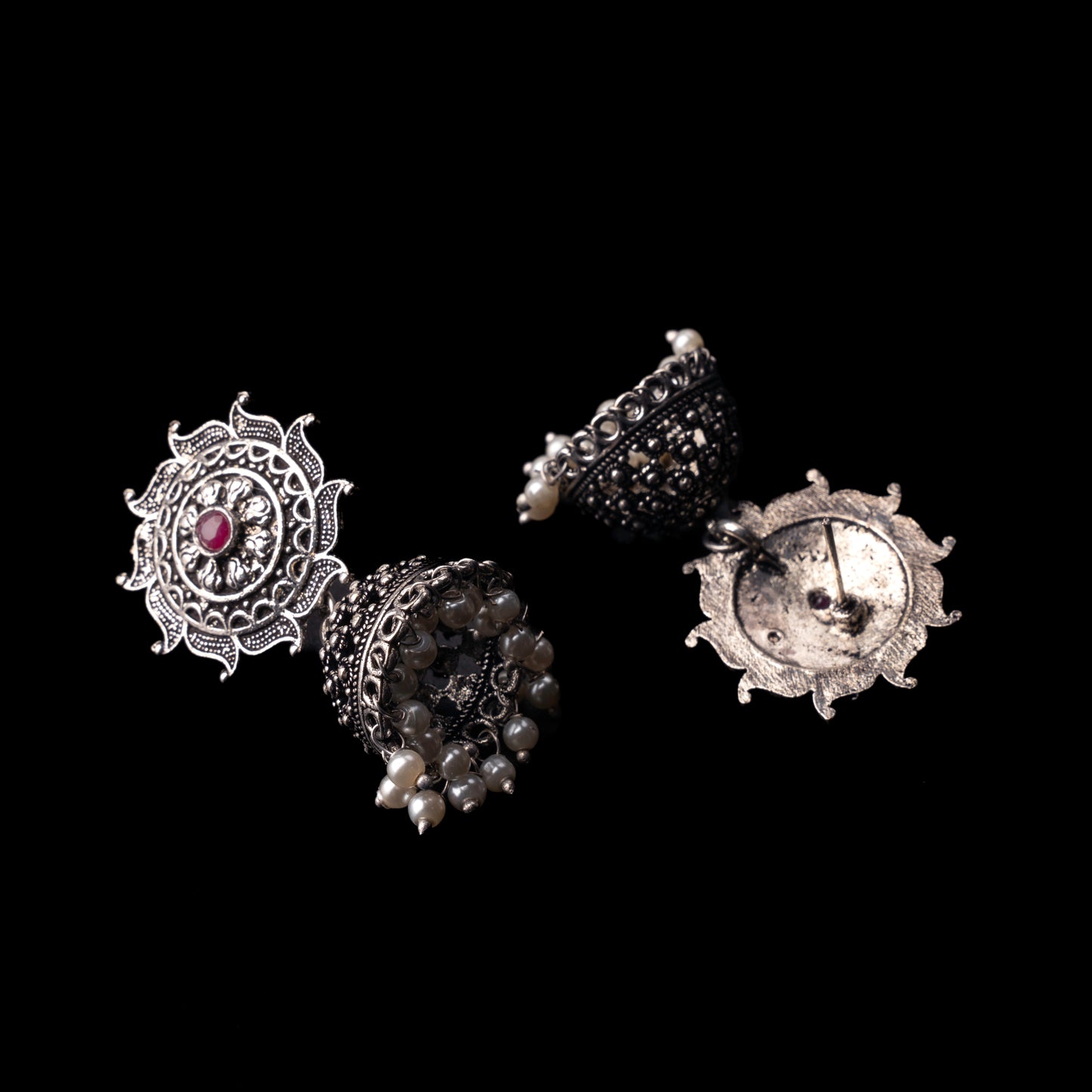 Red Stone Studded German Silver Statement Earrings With Brass Jhumki