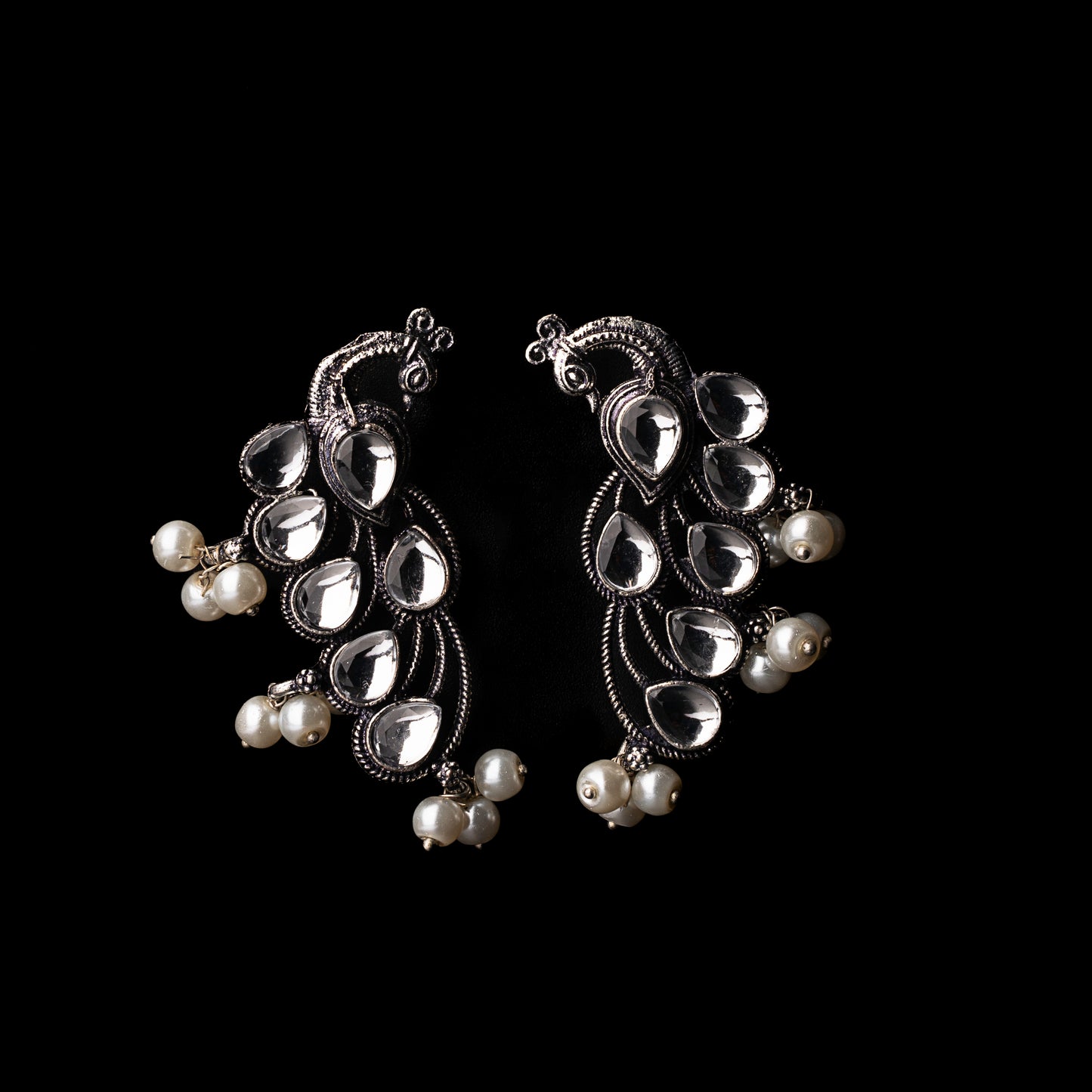 White Stone Studded Peacock Shaped Earrings With Hanging Pearls