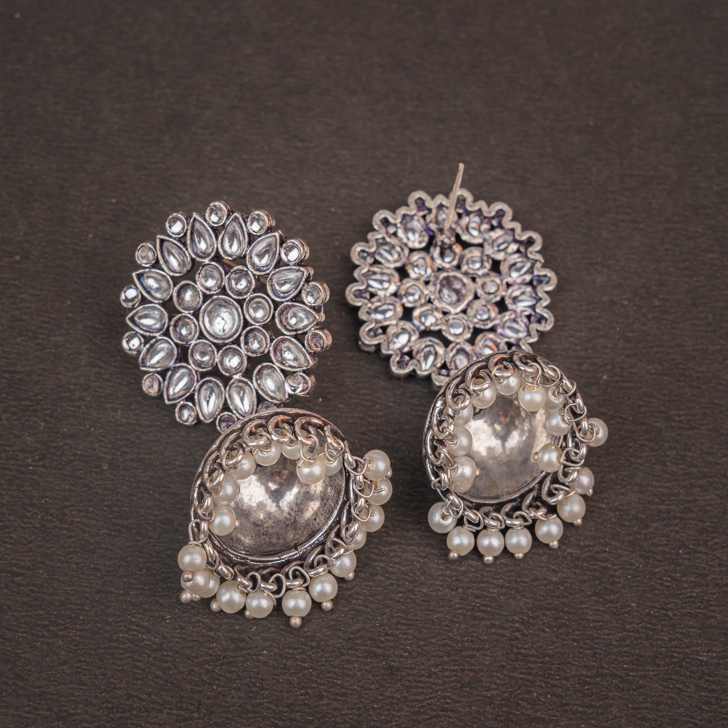 White Stone Studded German Silver Statement Earrings With Brass Jhumki