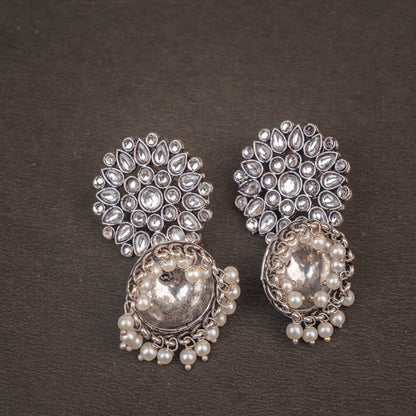 White Stone Studded German Silver Statement Earrings With Brass Jhumki