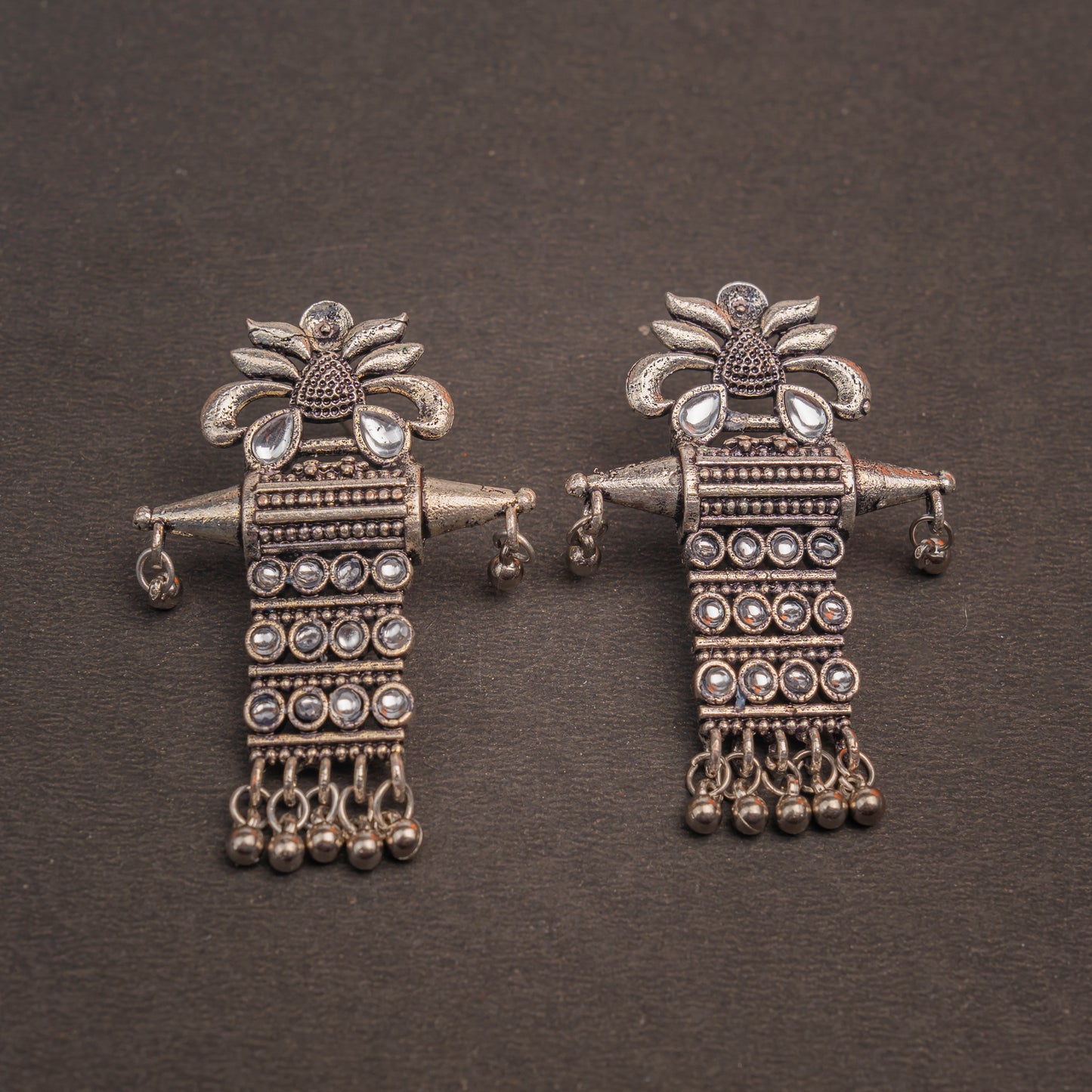 White Stone Studded Oxidised Earrings With Hanging Ghunghuroo